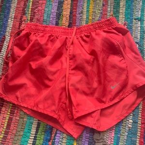 red/pink nike shorts